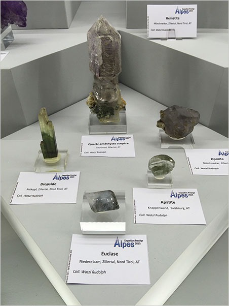 More Alpine views Also from the Alps exhibition, a variety of specimens from Tirol and Salzburg, Austria. Like an antique telephone pole insulator, the amethyst scepter at center displays only a hint of purple. (Photo: Will Larson)