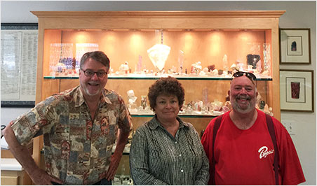 At Pala International's mineral preparation room, with a San Diego County collection behind, Bill Larson, Betty London and David London. Betty chose to have a nice day in Fallbrook as we convoyed to the mines. (Photo: Will Larson)