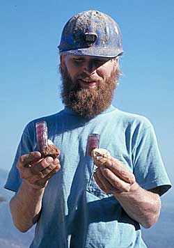 Score! Pala’s mining wizard, John McLean holding two beautiful blue cap tourmalines that he had just unearthed.