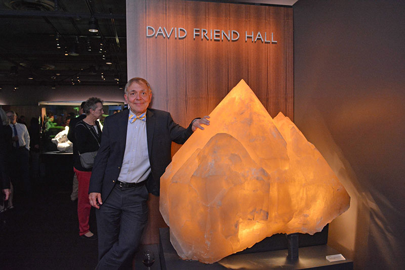 David Friend stands beside the 2,000-pound quartz crystal from Namibia that greets visitors to David Friend Hall. The photo was taken during a ribbon-cutting ceremony held on Oct. 13, 2016. (Photo: Michael Marsland, courtesy of Yale University)