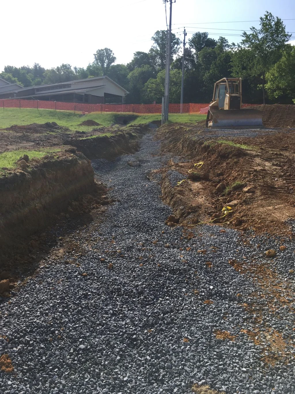 Electrical conduit trench filled with stone, conduits turning up pole - Copy.jpg