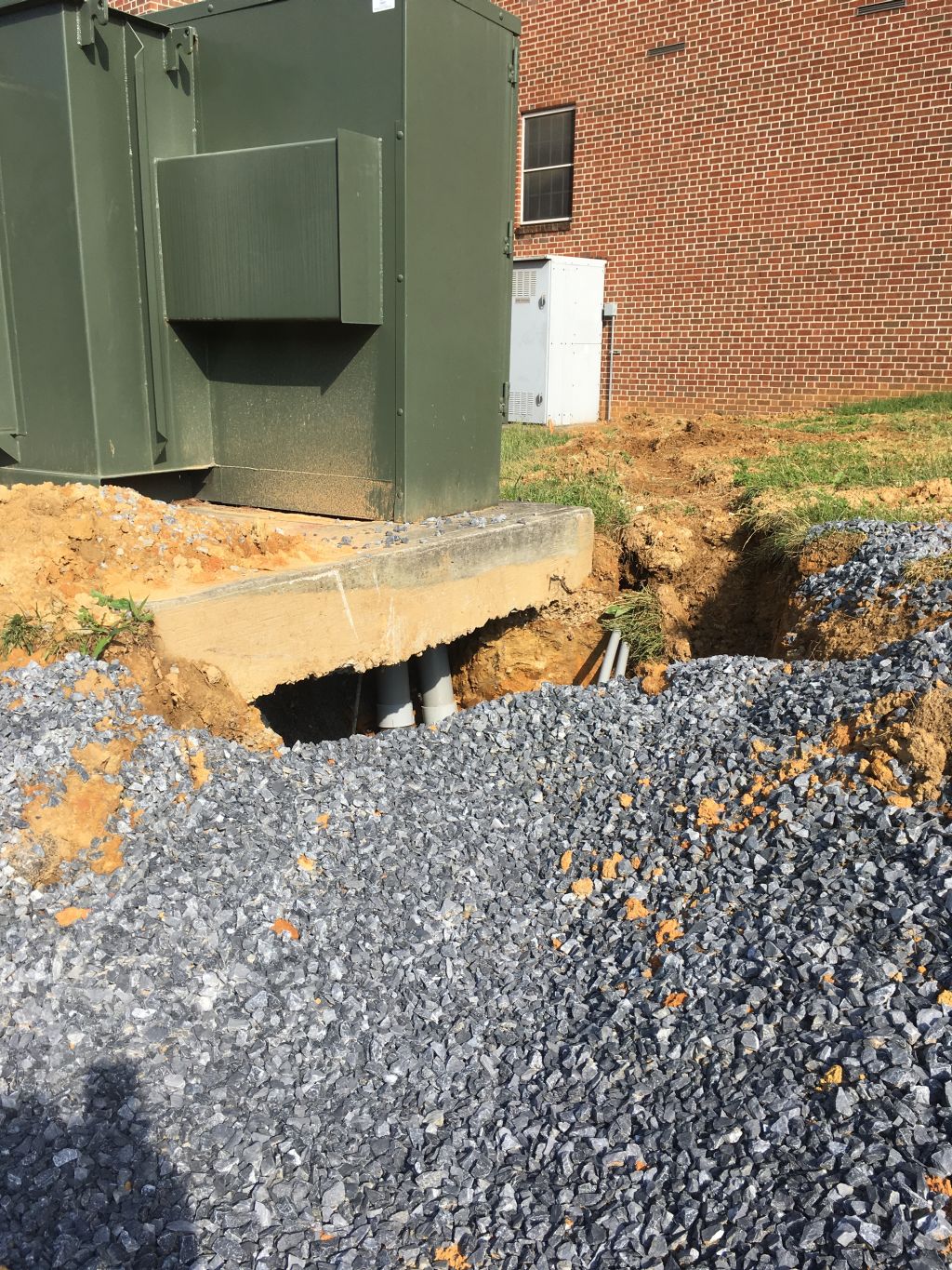 New conduit turning up under existing transformer.jpg