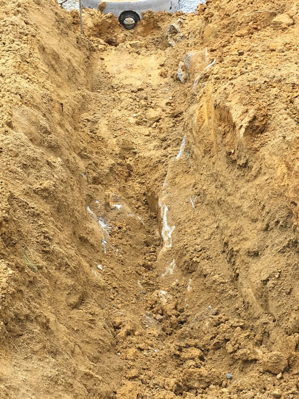 Rock each side of trench, very soft soil between 1.jpg