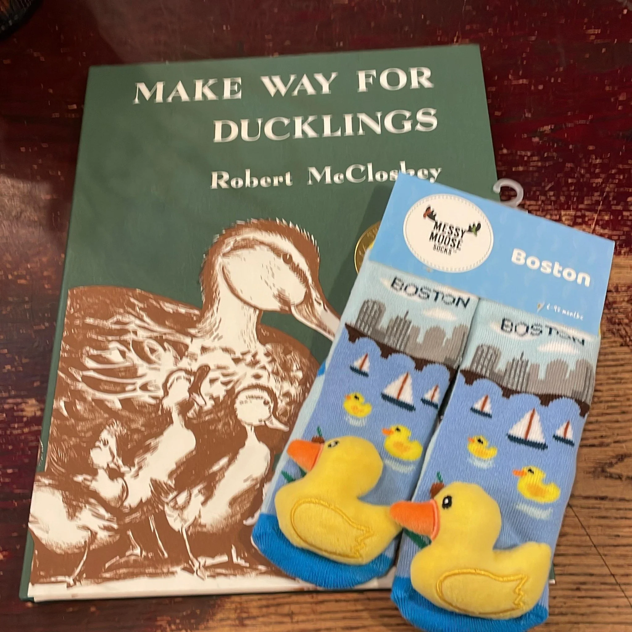 Look at this great present going out to a customer’s grandson. The classic “Make Way For Ducklings” and a pair of duck socks!