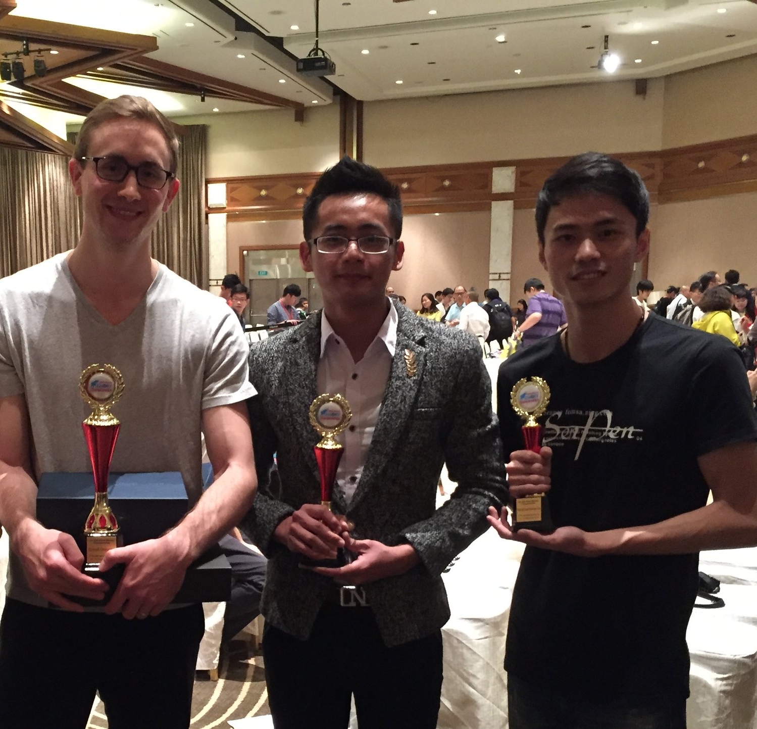 At the 2016 World Memory Championship in Singapore. Left to right: me, Huang Shenghua, and Su Zehe.