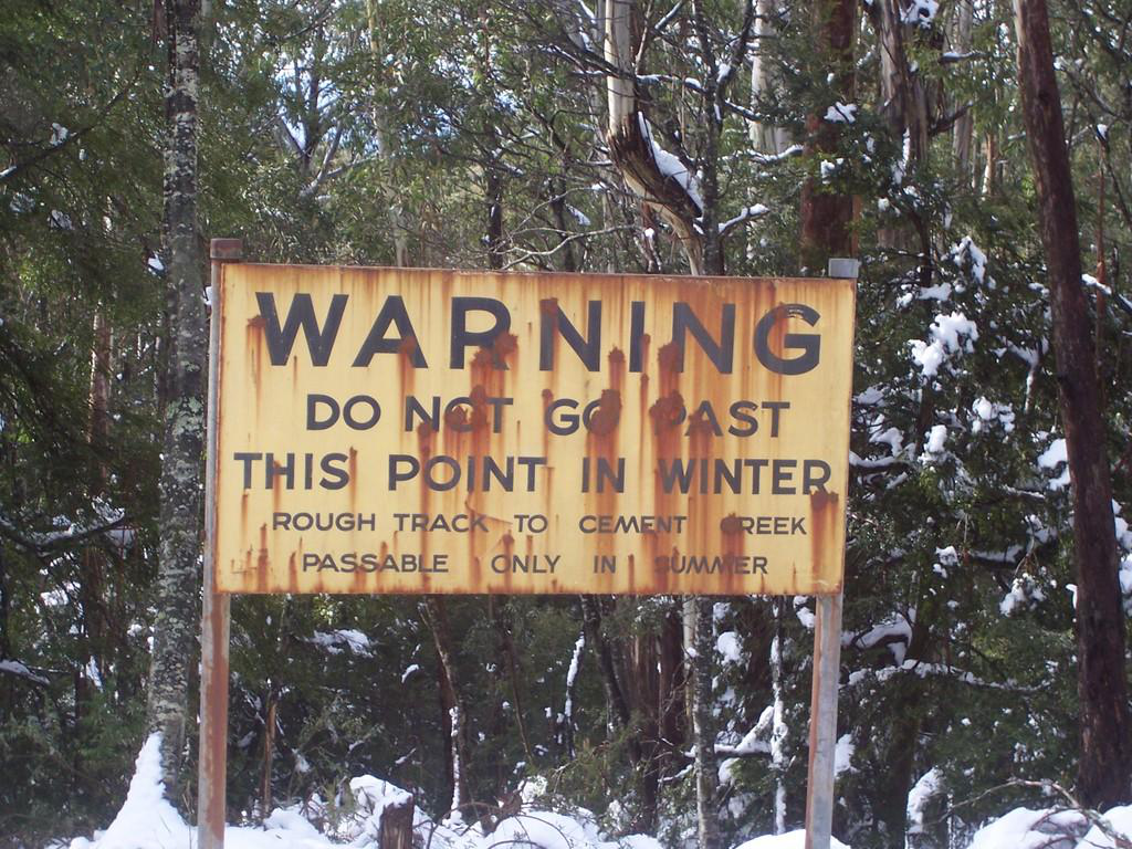 The warning sign north east of the summit. © David Sisson 2007.