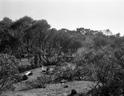  Early in the project the volunteers camped at the saddle at the south end of the ridge leading to the hut. This was because of access to the creek where aggregate for the concrete was gathered. Later when the main frame was progressing the camp was 