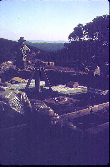 A poor photo – under the plastic sheet on the left are the floorboards and the aluminium frame members are stacked behind the theodolite tripod.