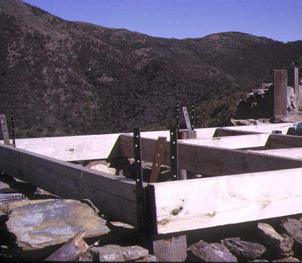 Front entrance – the straps were used to attach to the frame members so that the weight of the rock walls could be used to resist wind loads.