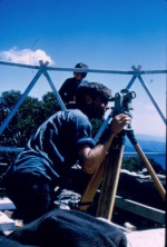  Peter Kneen with the theodolite. This was borrowed from the Civil Engineering school (Uni of Melbourne). It was sealed up and hidden in the bushes after a weekend’s work. 