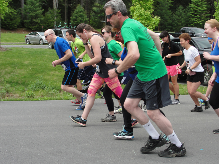 Runners and walkers cross the starting line at the 1st Annual Run/Walk for Wellness 5k held at Sinnemahoning State Park on May 17, 2015.
