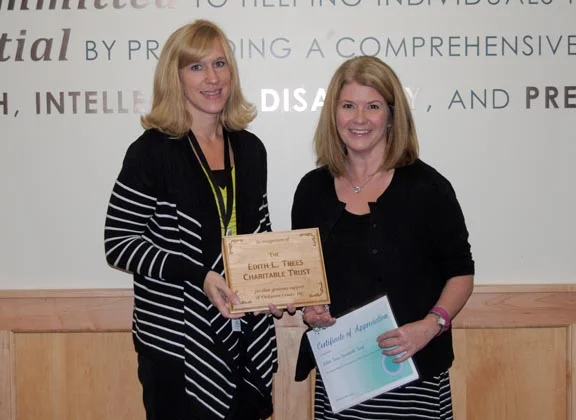 Pictured L-R: Heidi Thomas, DCI Interim CEO presents a plaque and certificate of appreciation to Amanda Creps, Trustee from the Edith Trees Charitable Trust