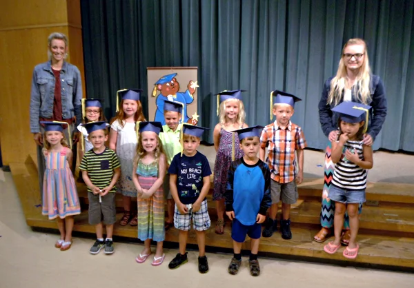 Photo of DCI staff with children
