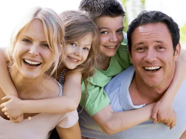 photo of 2 parents and 2 children