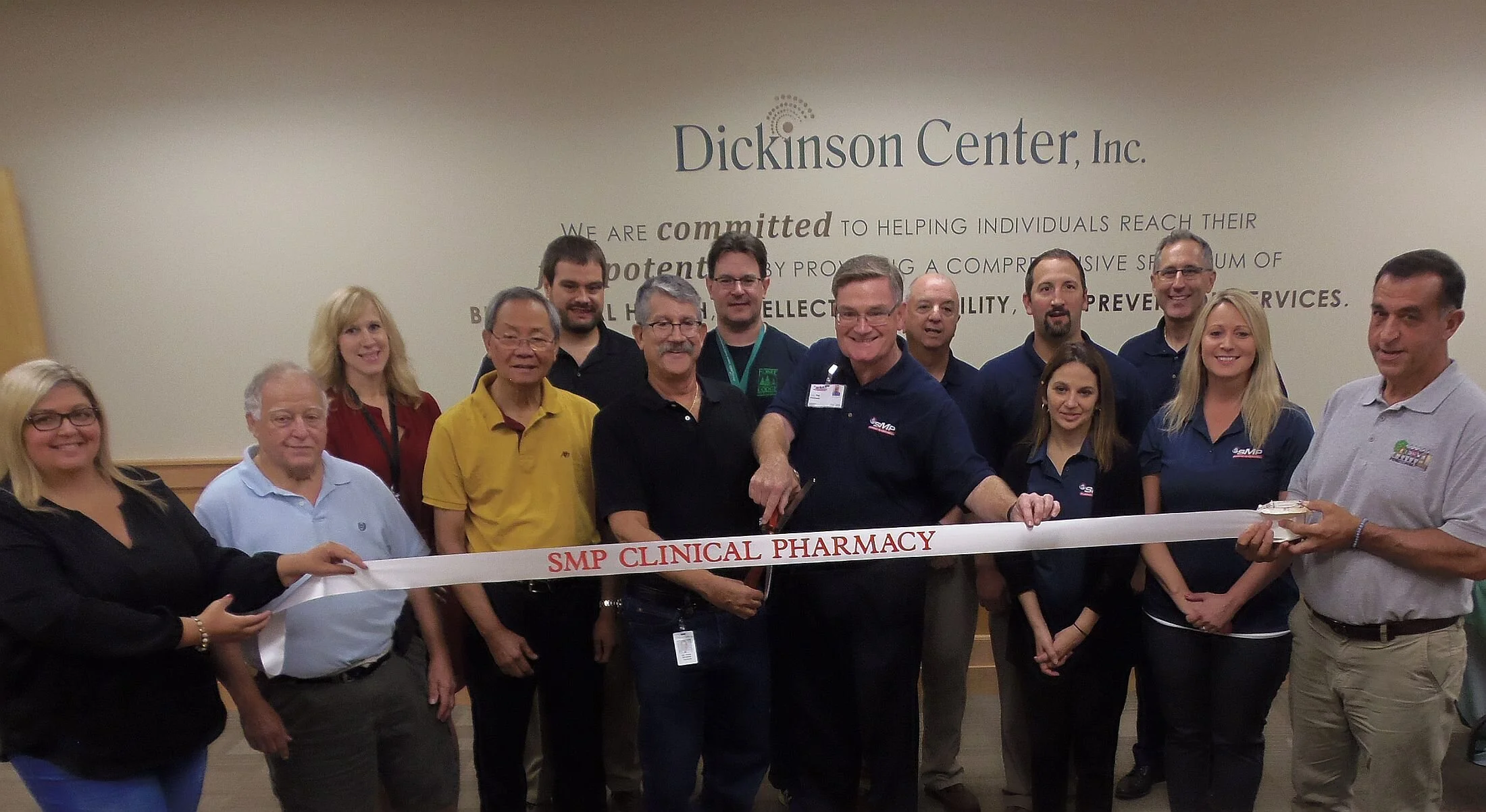 Pictured from left front: Ridgway-Elk County Chamber of Commerce Treasurer Kylee Mader; Chamber President Ed Lavalle; Chamber Board member Dr. Guillermo Udarbe; Dr. Craig Richman of DCI; Pat Minard, PharmD from SMP, Amy Warmbrodt, RPH; Molly Beimel, PharmD; and Chamber Board member Genarro Aiello. Back row: DCI Executive Director Heidi Thomas; DCI Board member Joe Haines; DCI Nurse Practitioner Nils Magnusson, MSN, FNP-BC; Jude Vavala, RPH; Mike Vavala, RPH; and Frank Straub, RPH.