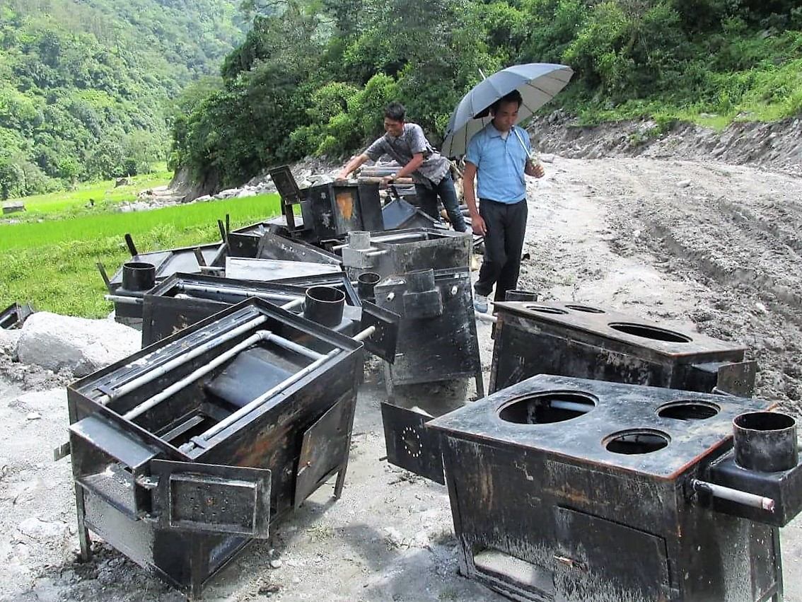 It takes two people to carry one stove, so 60 men and women make the trek down to the road head to collect their stoves. The trek down took at least two days, for some it was a four day walk.