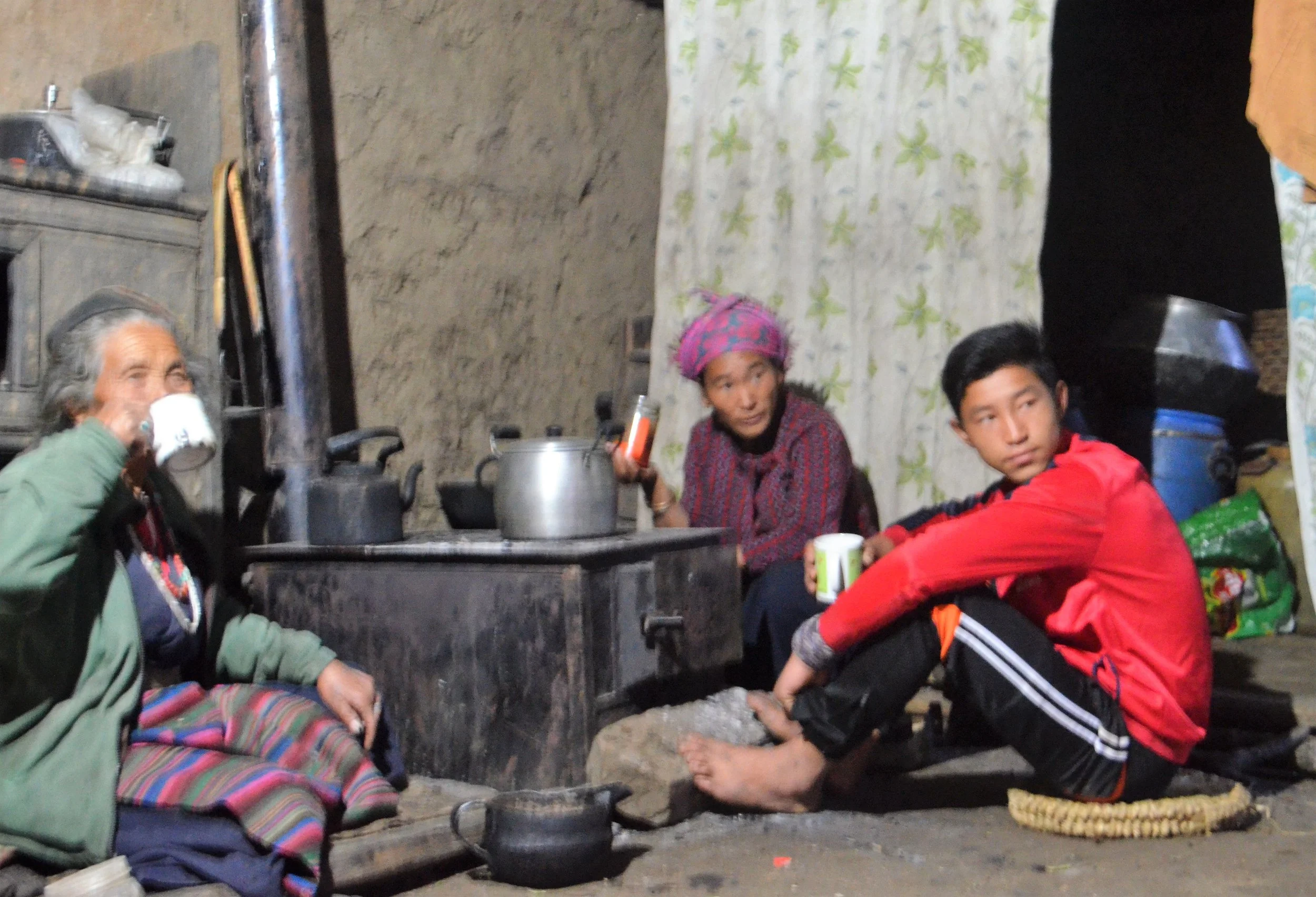 Once installed the stoves are put to use, they simultaneously heat the room, while also warming up water for tea and noodles. 
