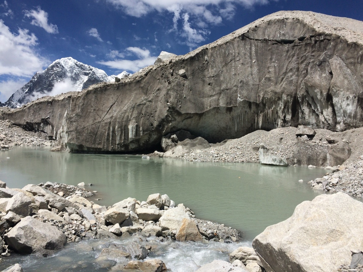 Figure 3 . Supraglacial pond and ice cliff on Khumbu Glacier (credit: Owen King).