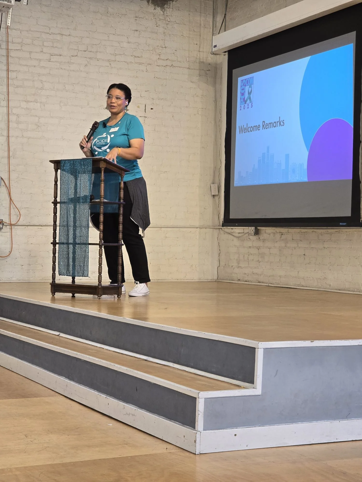 Co-founder Monica Reagor gives welcome remarks at PCOS CON 2025