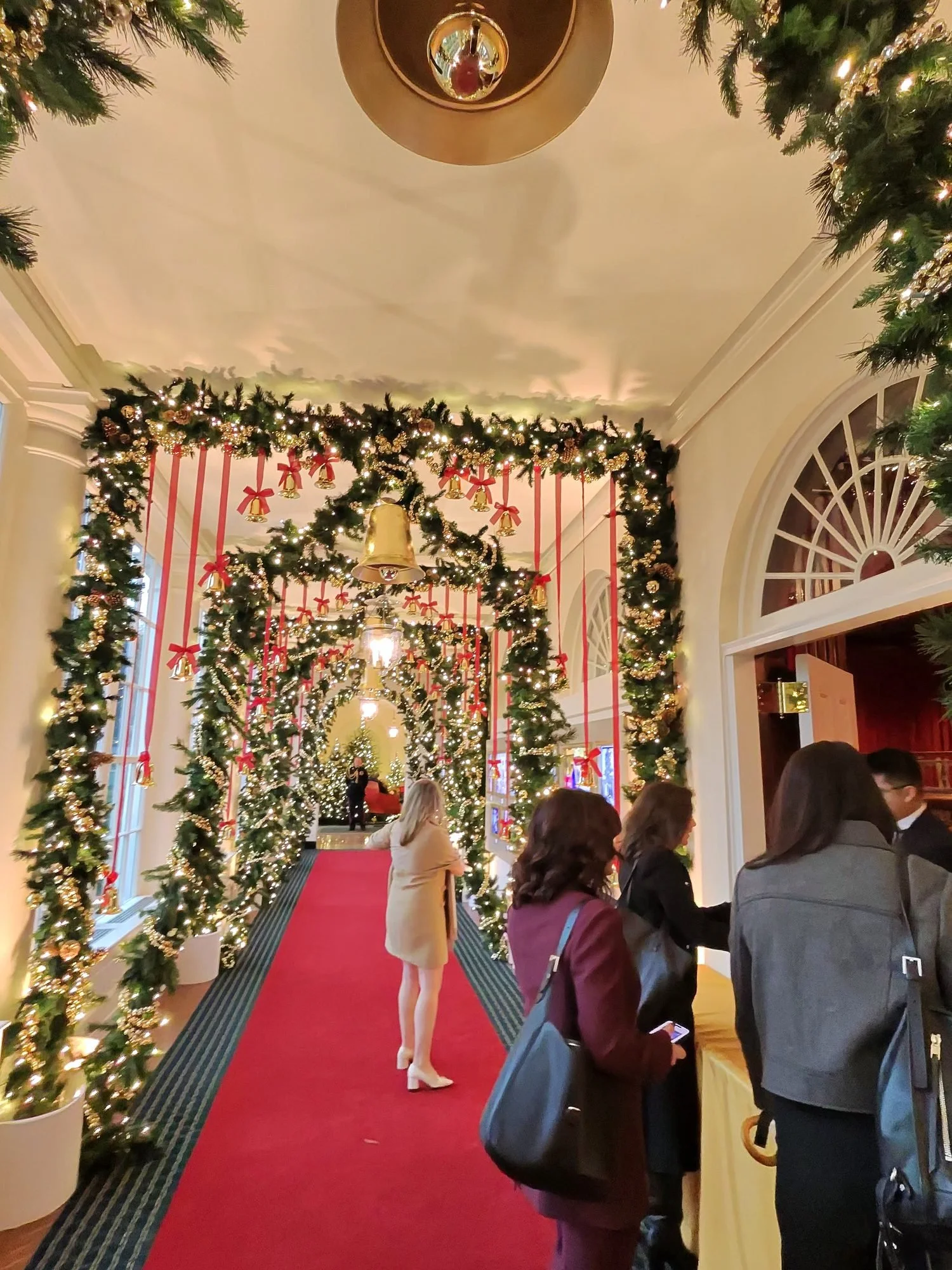 Guests arriving through the White House East Colonnade, decorated for the holidays
