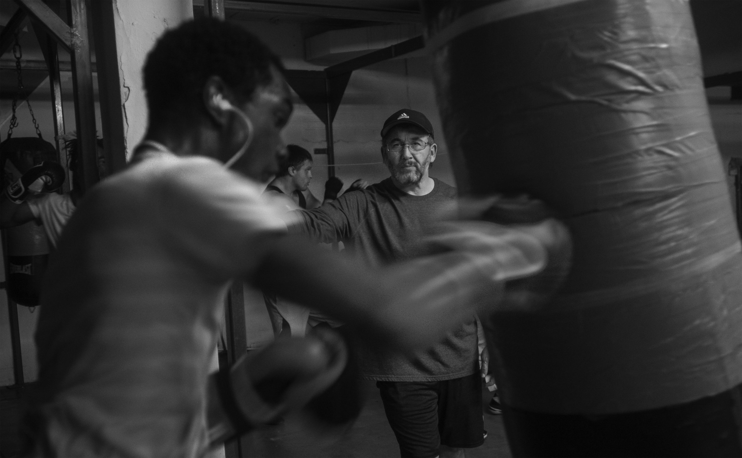  Spikes and his coach, Steve Douthitt, chat between practice rounds in the ring. Douthitt has been working with Spikes to improve his form and technique since he started coming to the gym two years ago. 