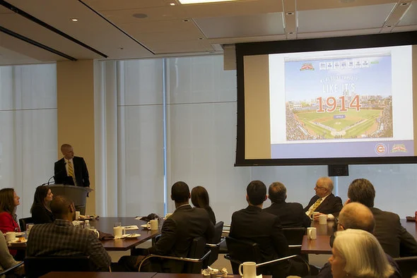 Kevin Saghy, Midtown Center tutor and manager of communications for the Chicago Cubs, gave 80 guests an inside look at the team's plan to celebrate Wrigley Field's 100th birthday at a Breakfast for Champions on April 10. 