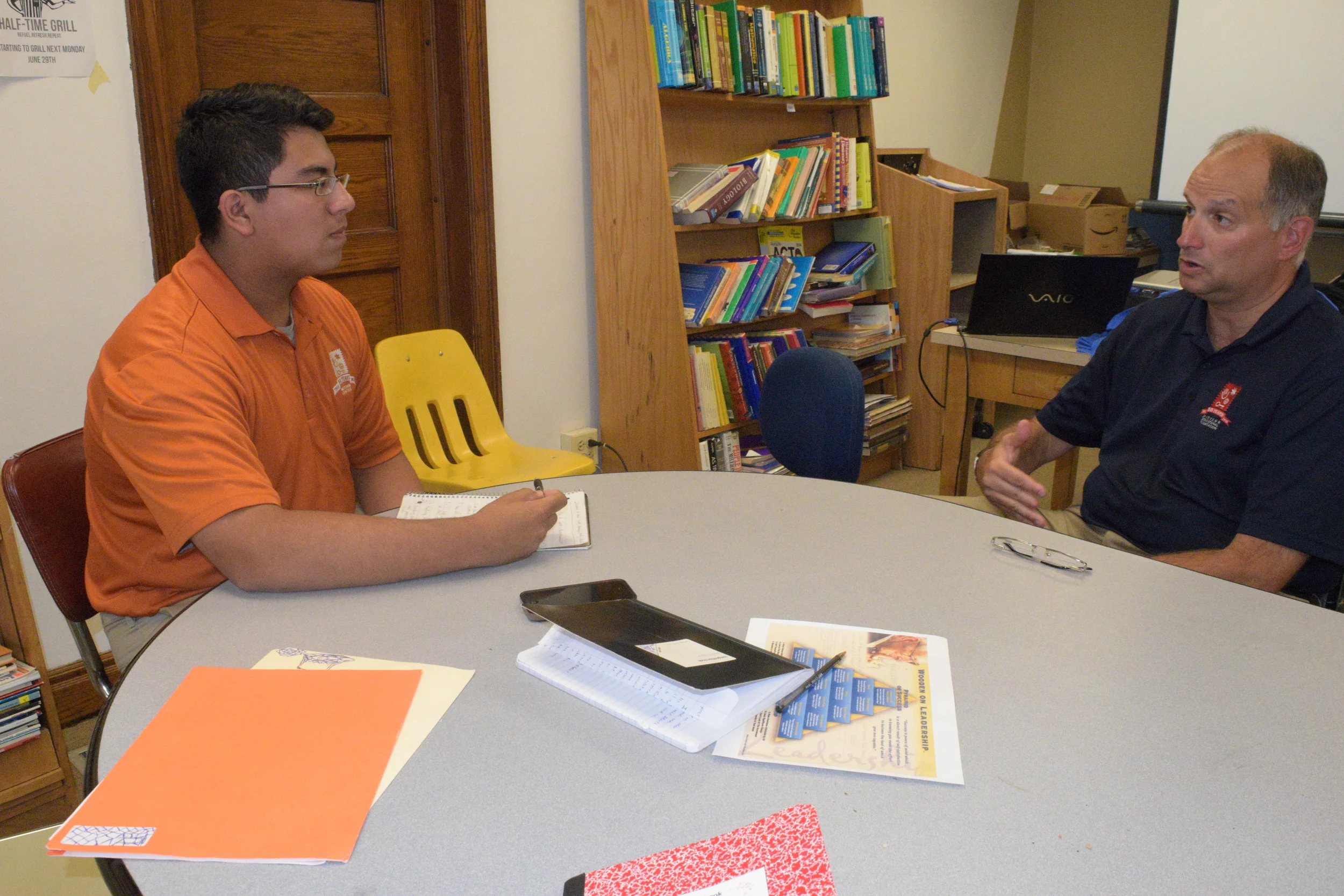 Midtown student Danny Sanchez interviews Andy Clark for a story in the Midtown Voice newspaper.