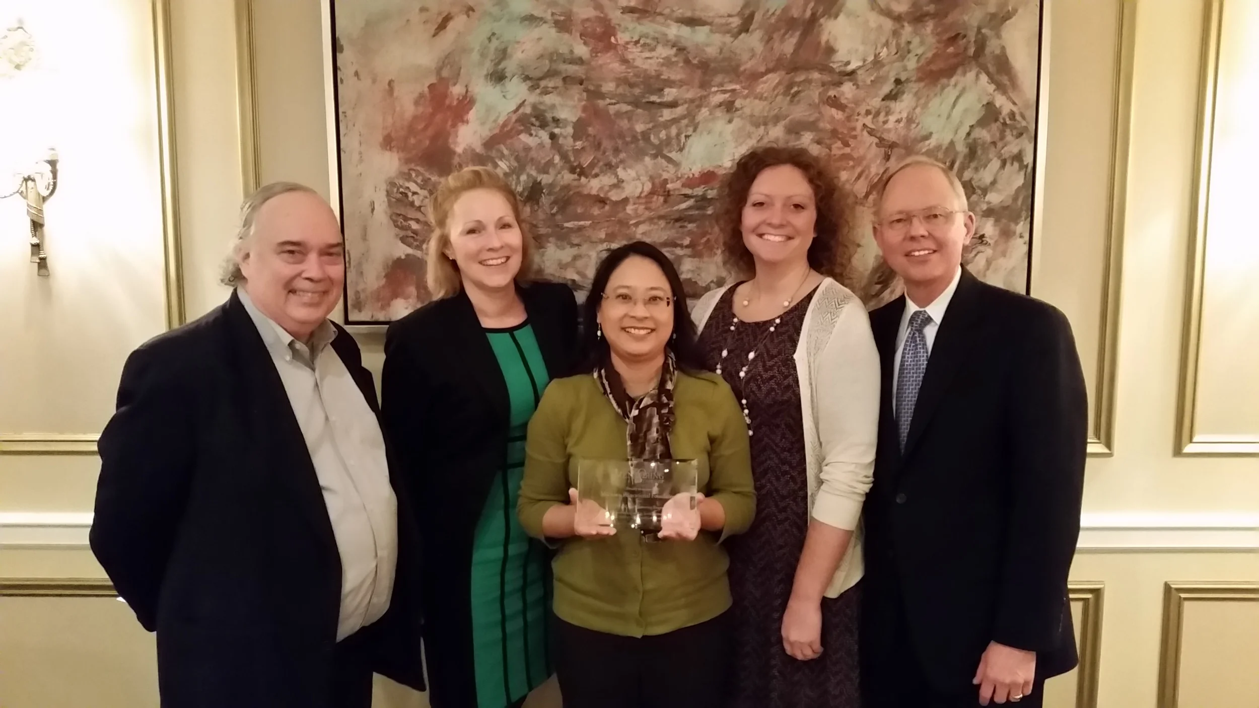 Jerry Shepherd, Margie Morris, Cristy Acosta, Erin Aldrich and Glenn Wilke, as MEF accepts the awards from Morris, IMP's Executive Director.