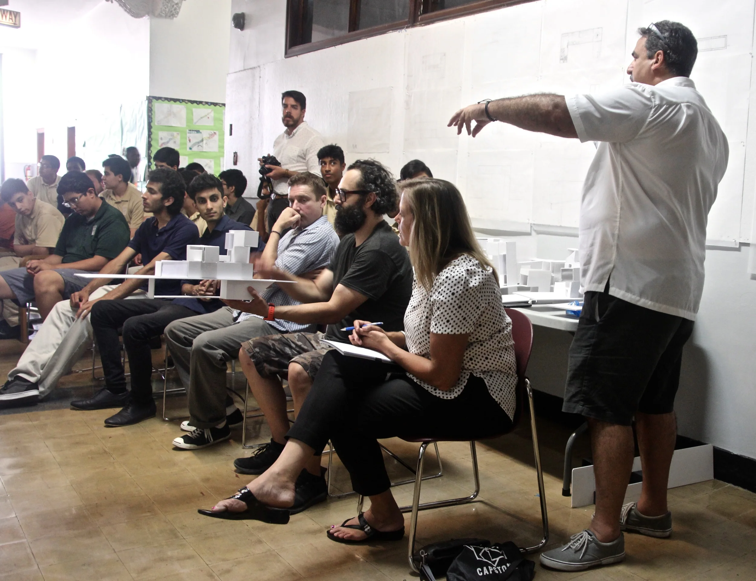 Carlos Concepcion, in his fifth year of teaching the Midtown Architecture Apprenticeship, describes the assignment to the panel of architects.