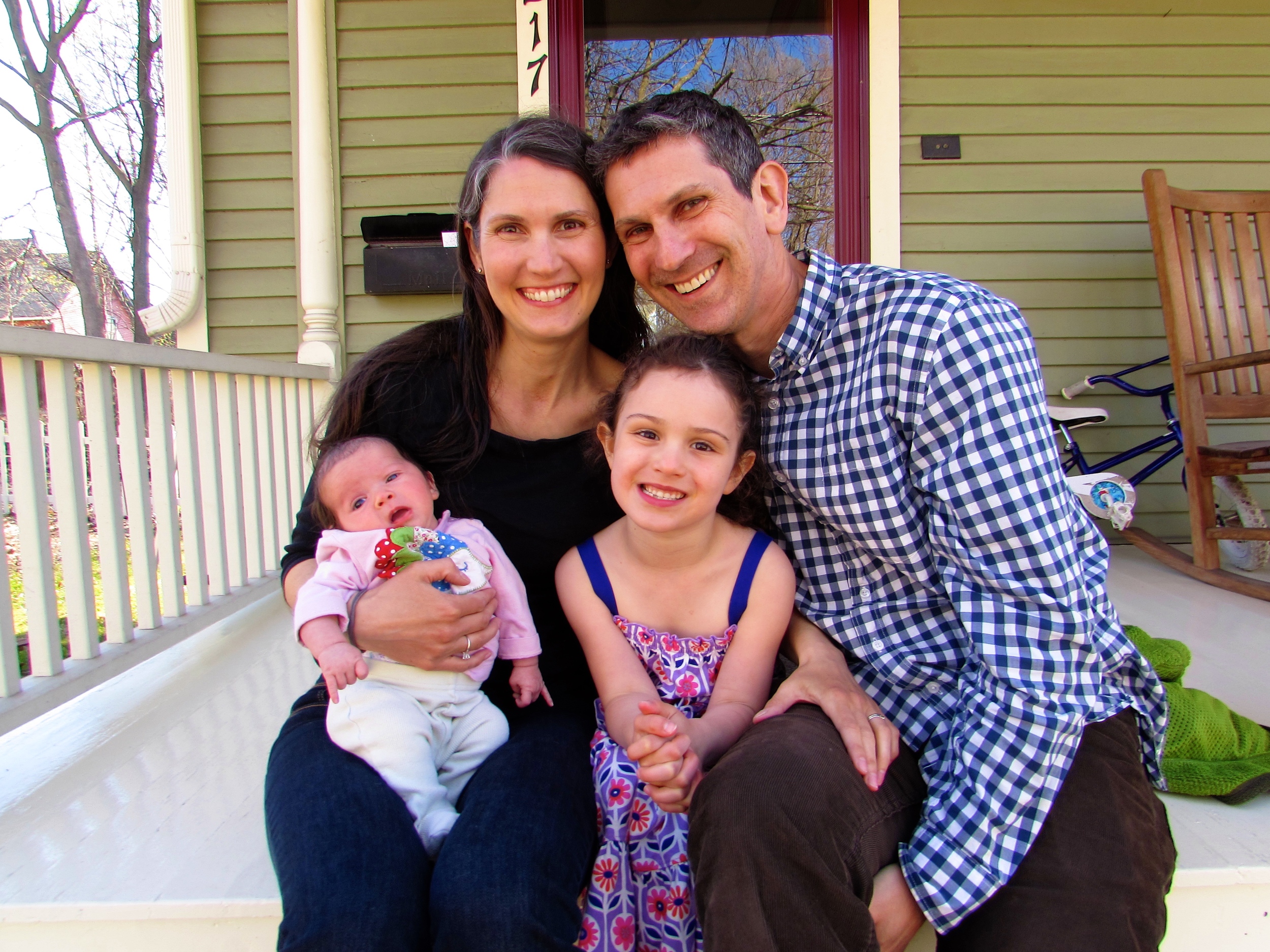 My family on the porch of our Net Zero Energy Certified home. 