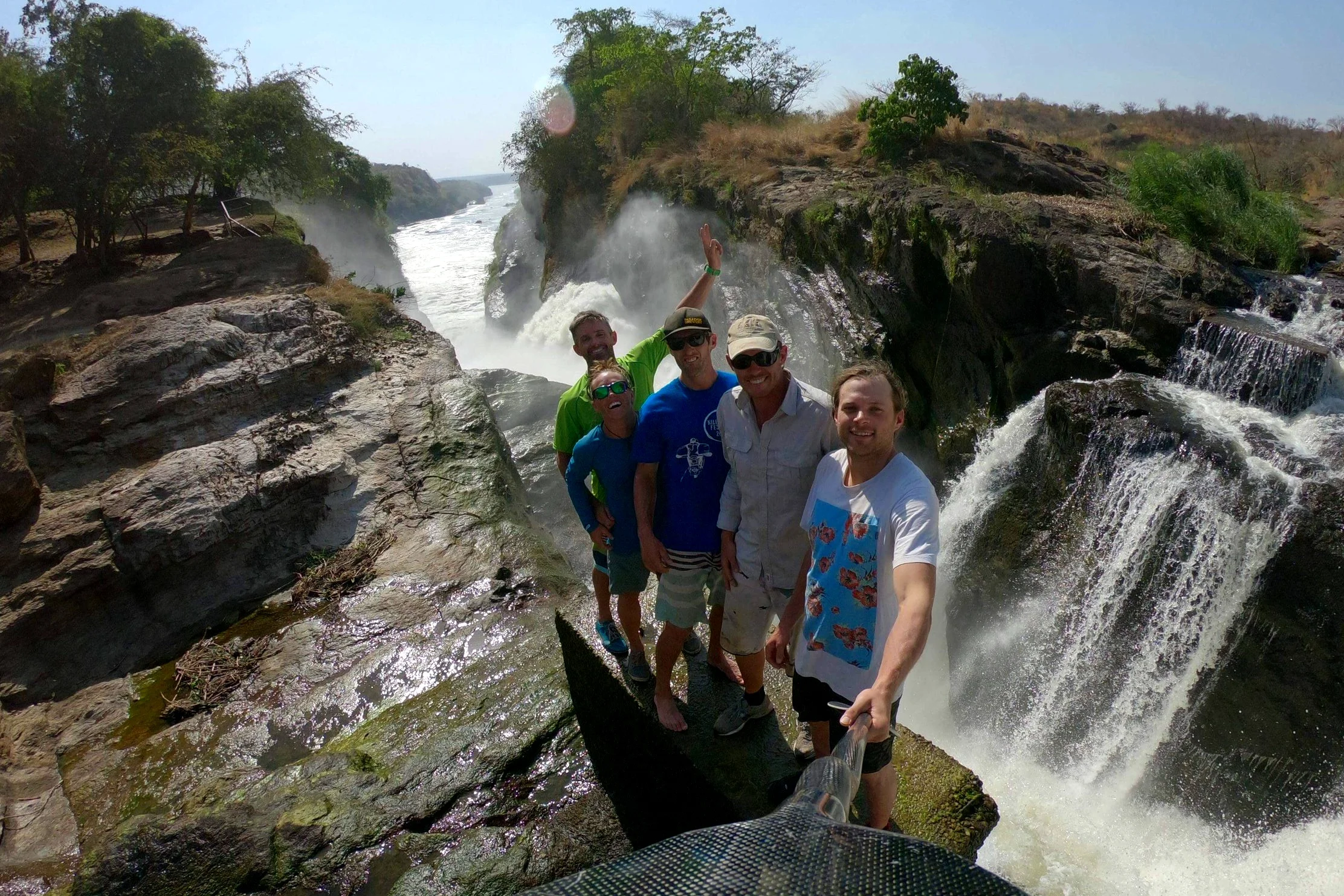 Standing at the top of Murchison Falls with the crew. Photo: Benny Marr