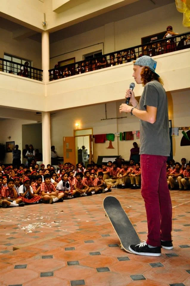 Nathaniel sharing the Gospel with students in India after a skateboard demo. 