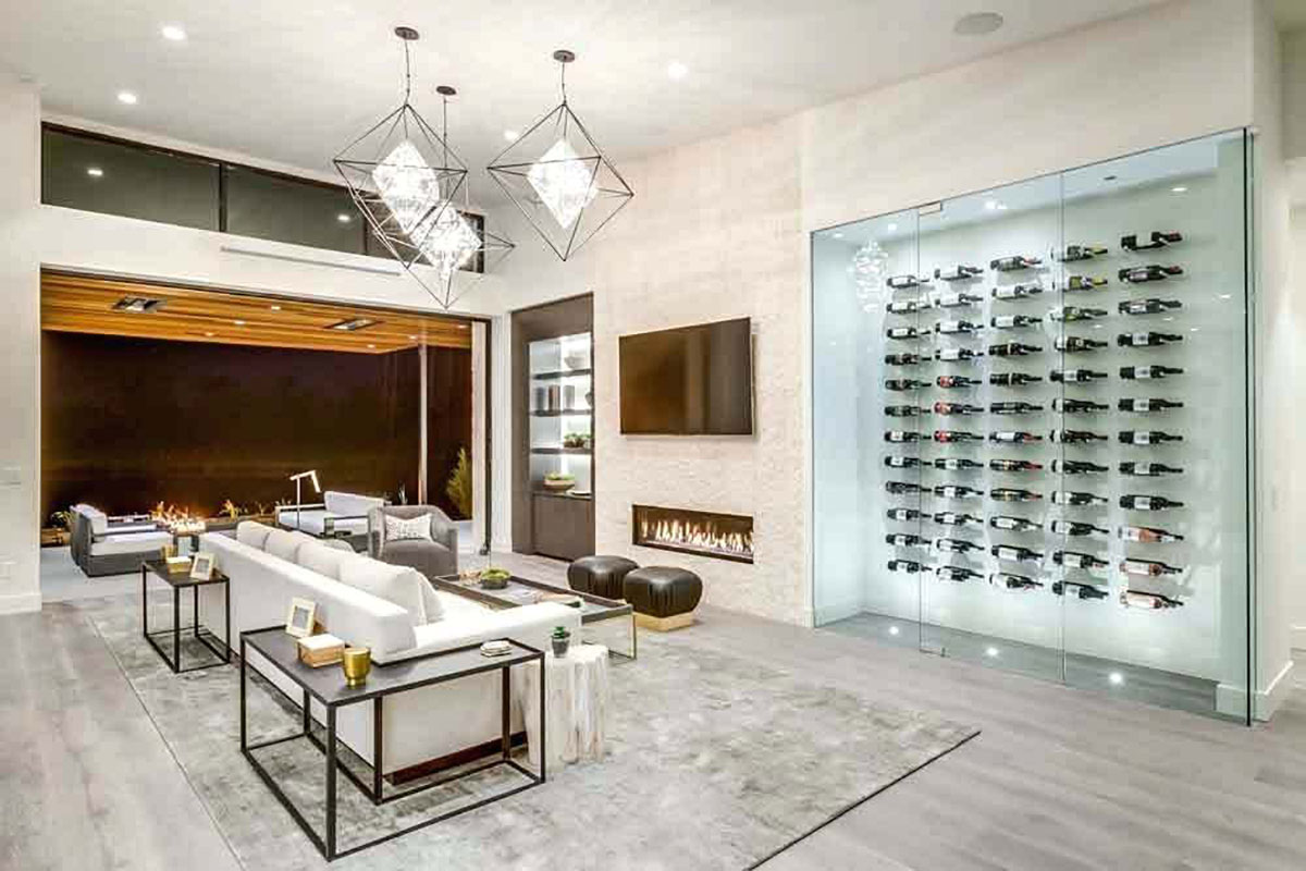 A bump out is a great way to keep an open floor plan while adding a modern wine cellar display.