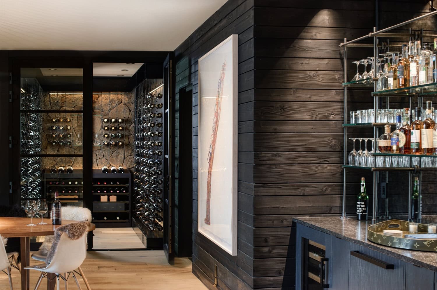 Custom glass wine cellar, dining lounge and home bar designed by Sommi Wine Cellars