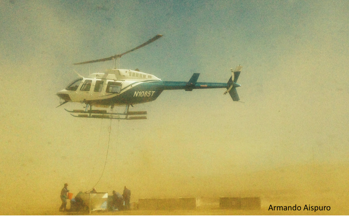 A helicopter and a hopper is used to deploy ant bait over hundred of infested acres on San Clemente and Santa Cruz Islands, California. 