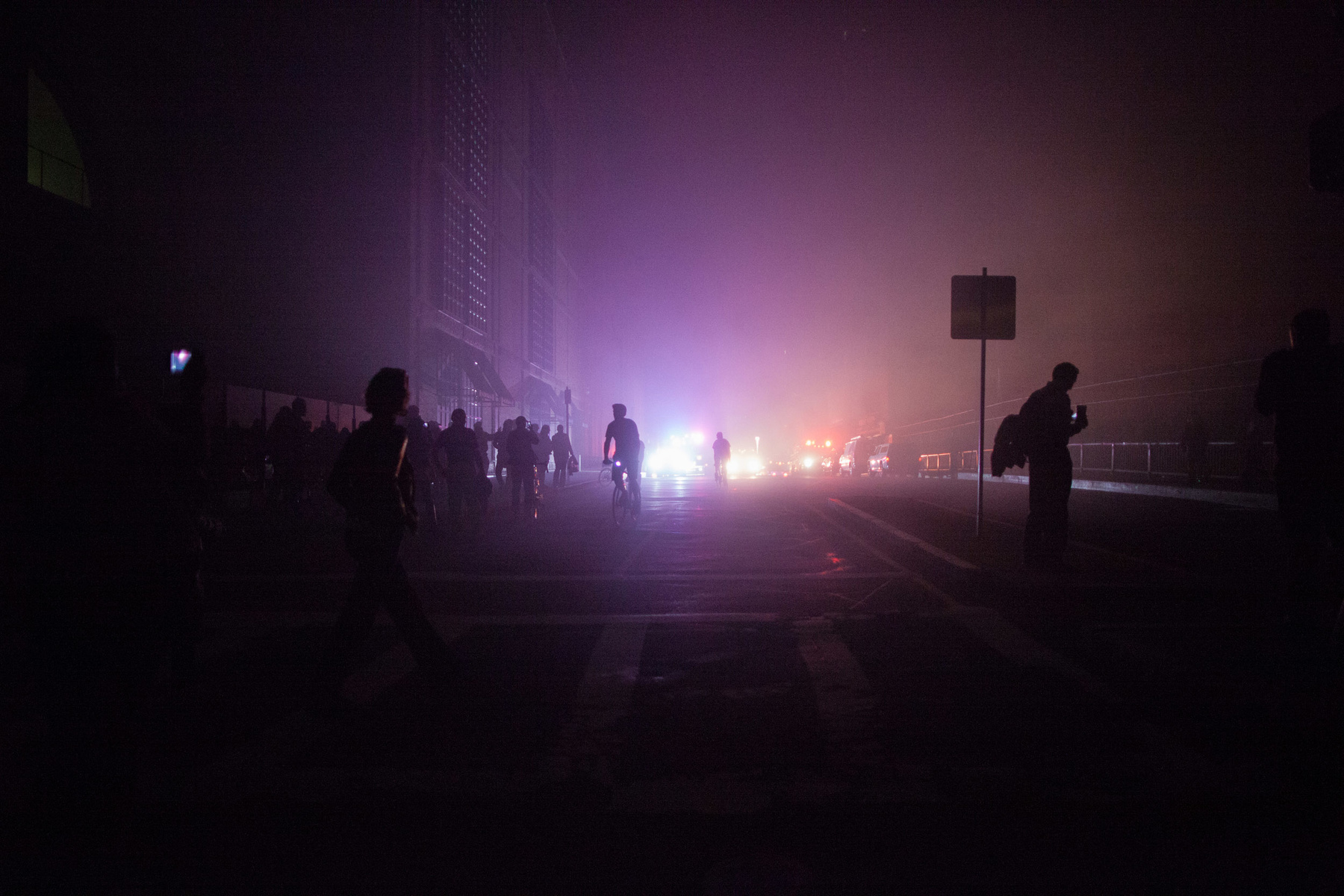 Boston, Mass. - Residents and tourists flee the area of Boylston and Dalton Streets where the parking garage attached to the Hilton Hotel at 40 Dalton St., was engulfed in flames where a electrical substation was housed. The fire ended cutting power to most of the Back Bay and South End areas of the city.