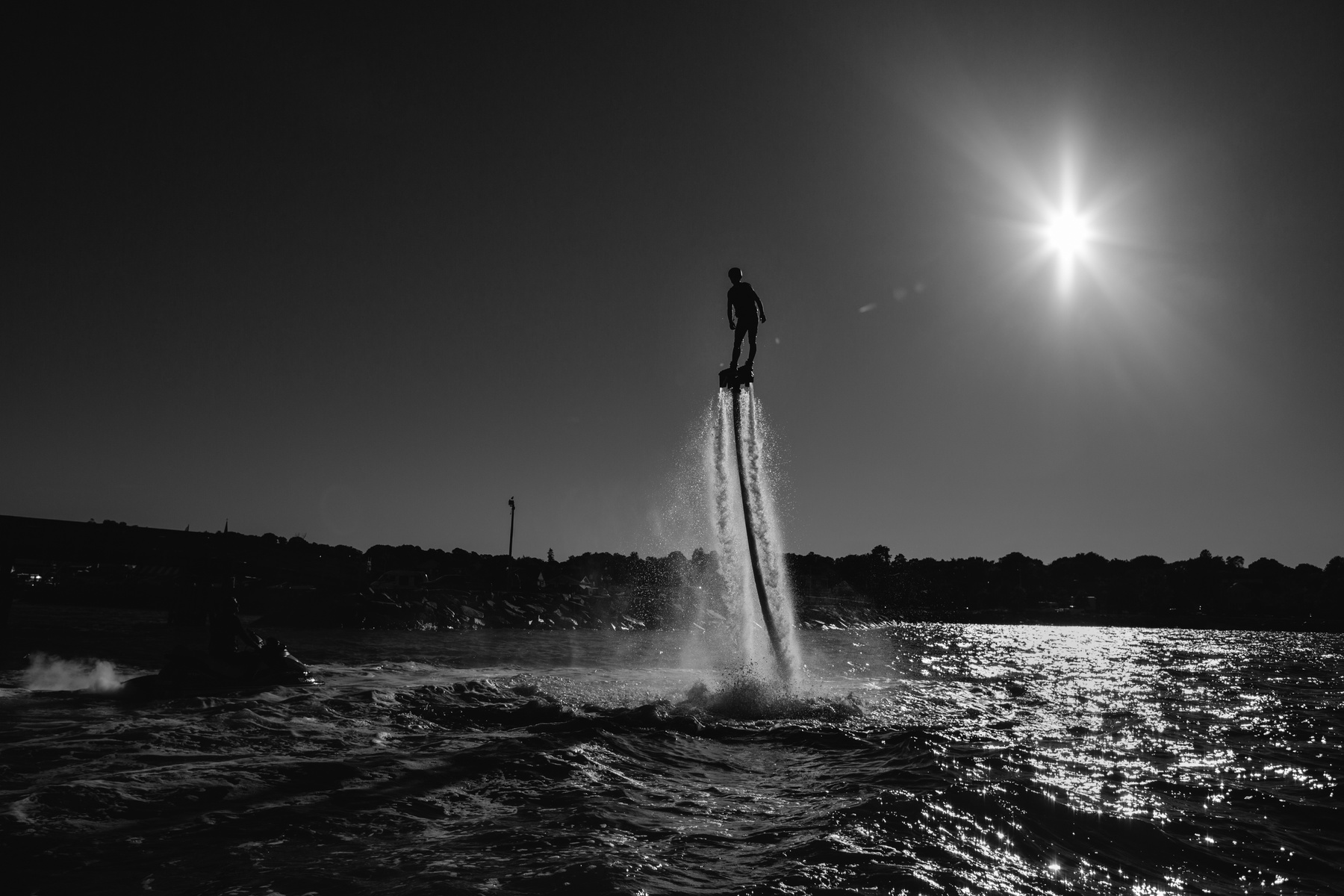 A "FlyBoard" instructor flies in Plymouth Harbor in Plymouth, Mass. on Friday, Sept. 27, 2013. This new sport that uses the water jet from a jet ski is the first of it's kind on the South Shore of Massachusetts.