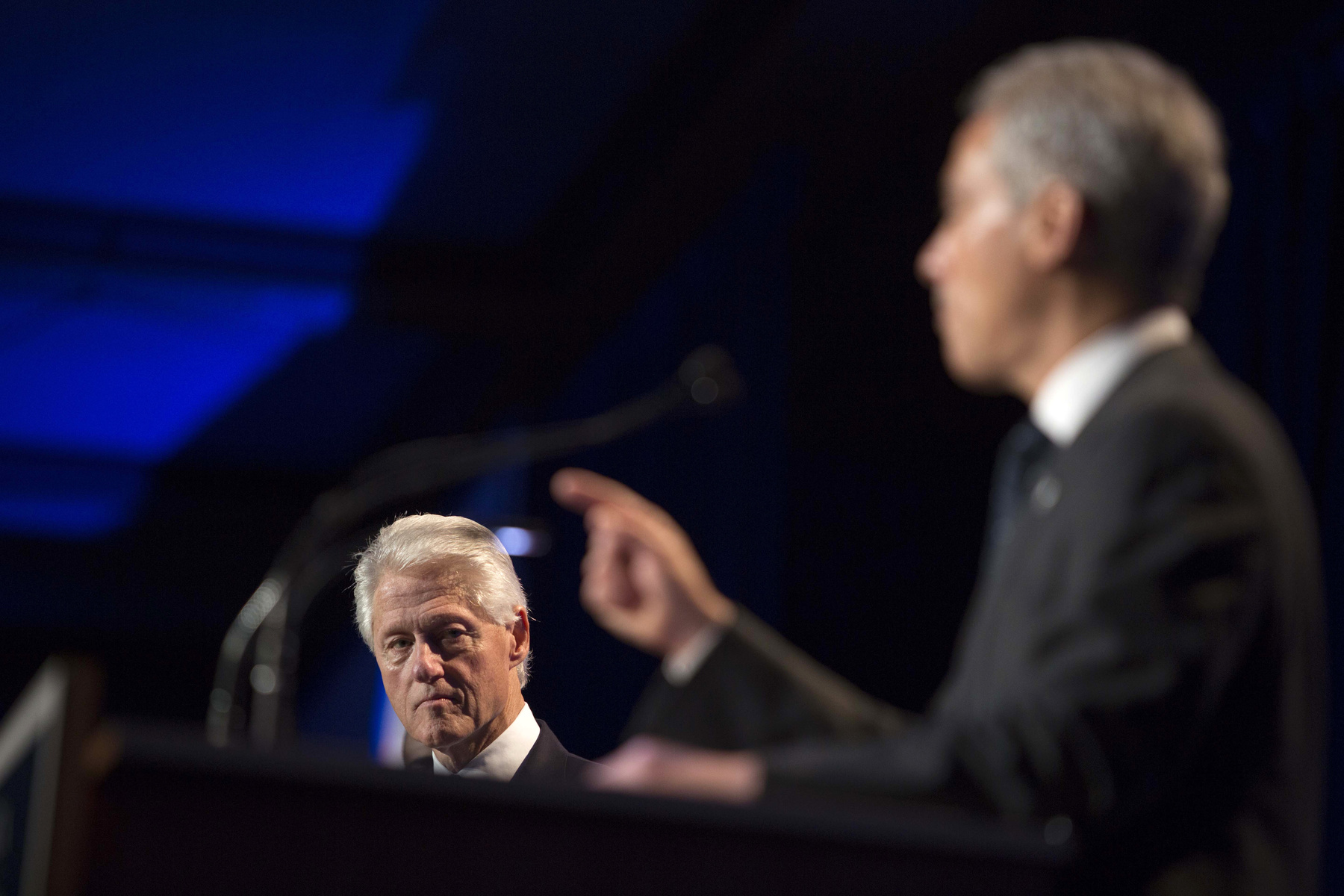 Former President Bill Clinton listens as Chicago Mayor Rahm Emanuel addresses the Clinton Global Initiative (CGI) meeting in Chicago, Thursday, June 13, 2013. During this opening session, politicians and business leaders to discussed new ways to achieve economic and social mobility. 