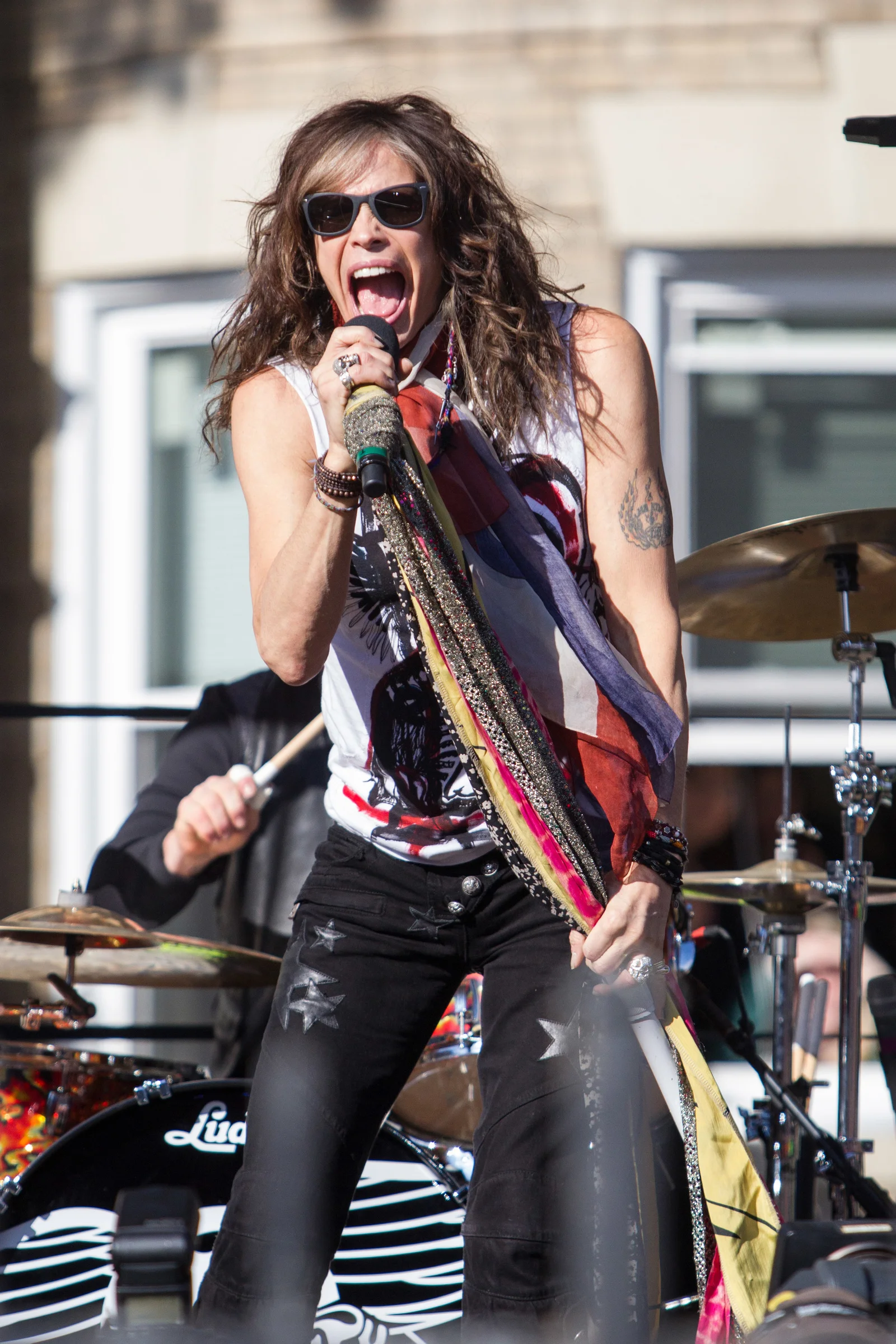 Steven Tyler of Aerosmith performs on Commonwealth Ave. in Boston, Mass.