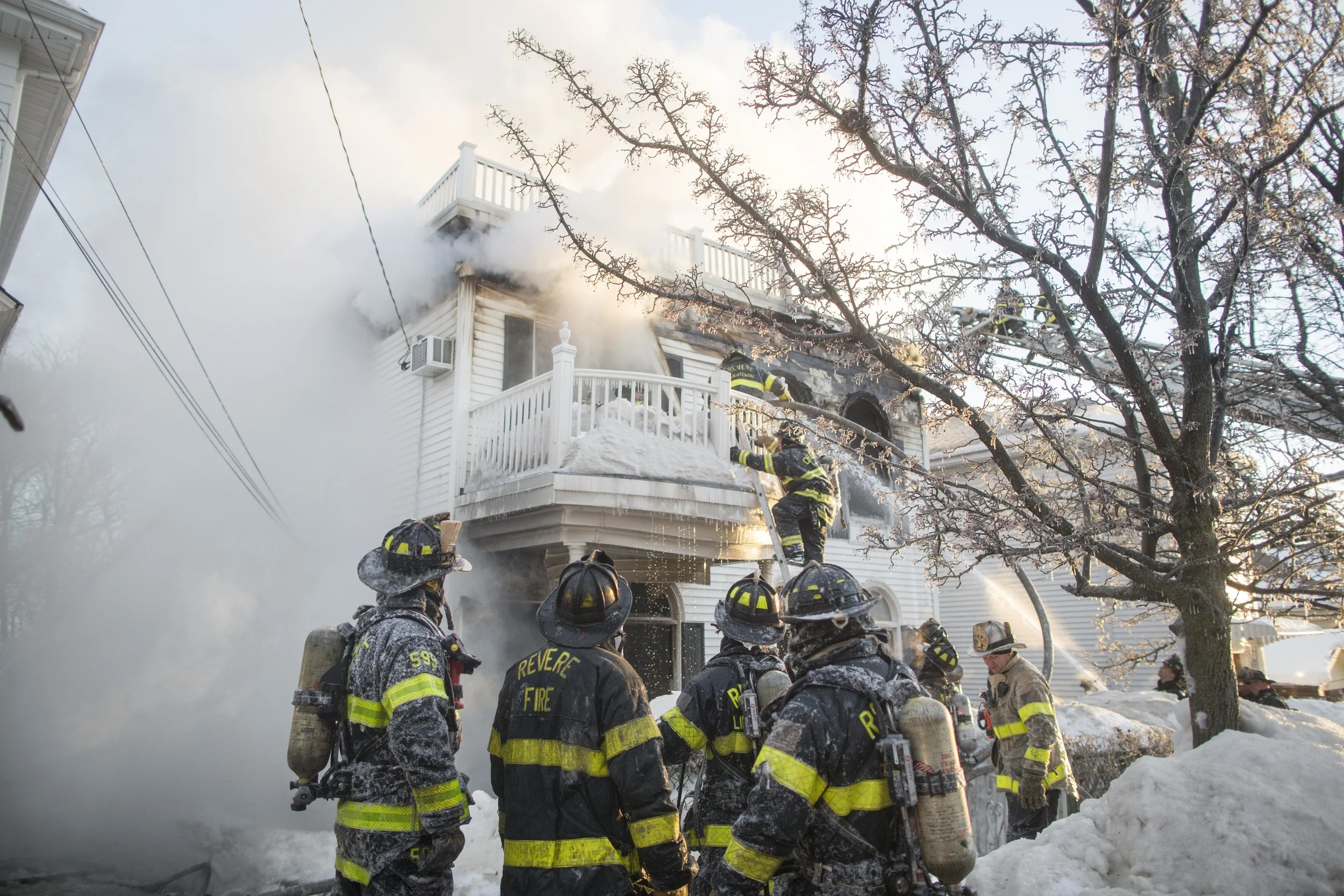  Firefighters fight a 3-alarm&nbsp;fire at 77 Reservoir Ave in Revere on Friday, Feb. 6, 2015. One person died, and multiple people were rescued from the blaze. 
