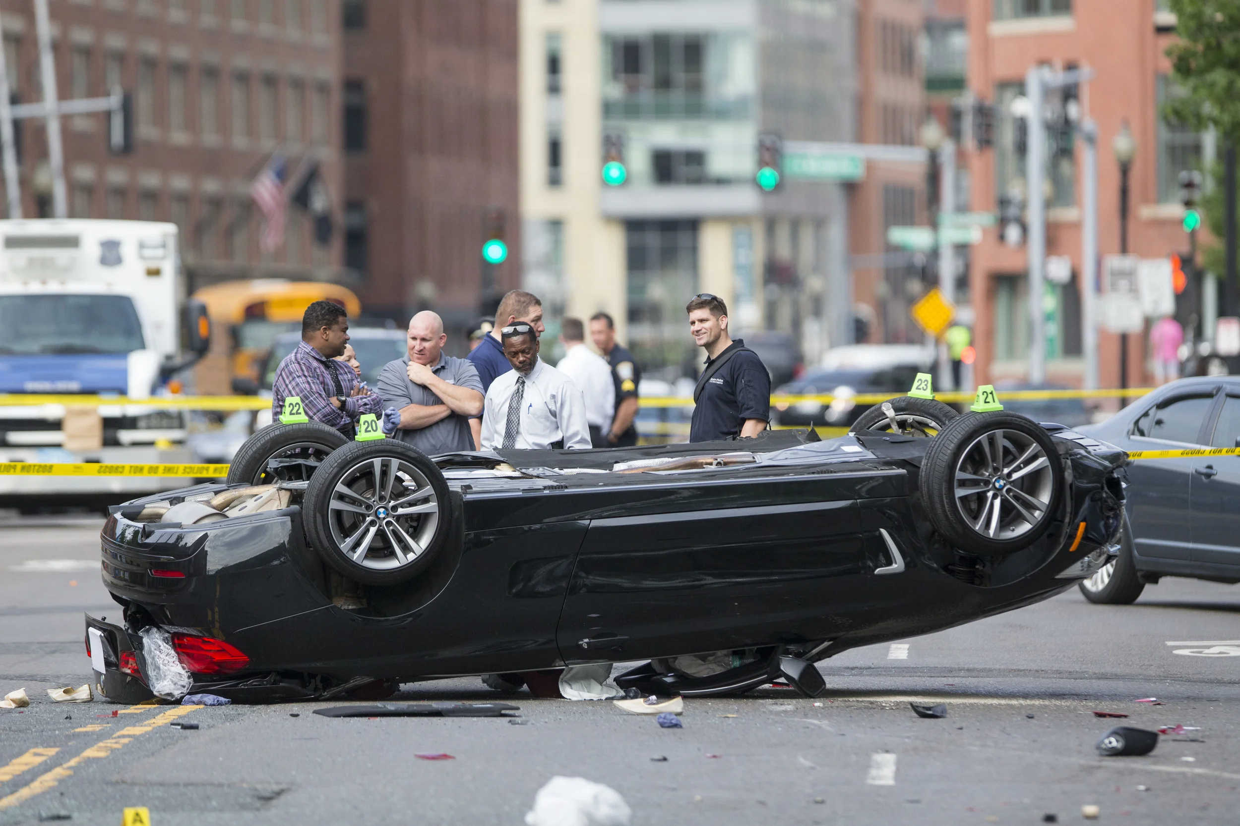  Police investigate a double-fatal rollover accident on Commercial St. in the North End neighborhood of Boston on Friday, June 12, 2015. 