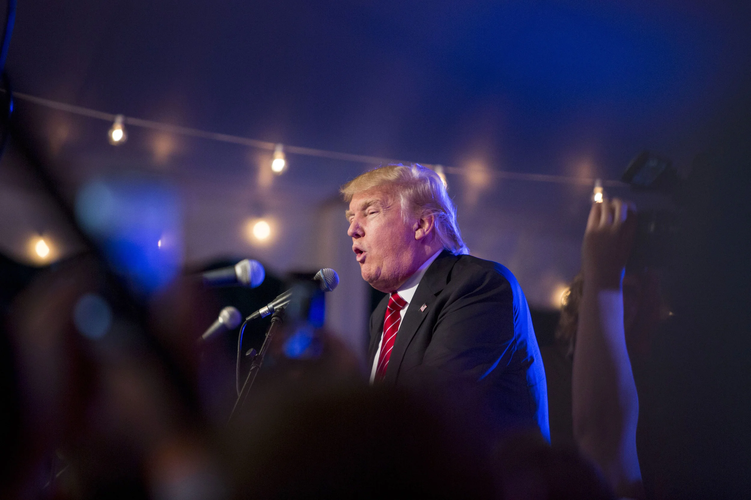  Republican Presidential candidate Donald Trump talks on stage at Ernie Boch Jr.'s annual summer bash and fundraiser in Norwood, Mass. on Friday, August 28, 2015. 