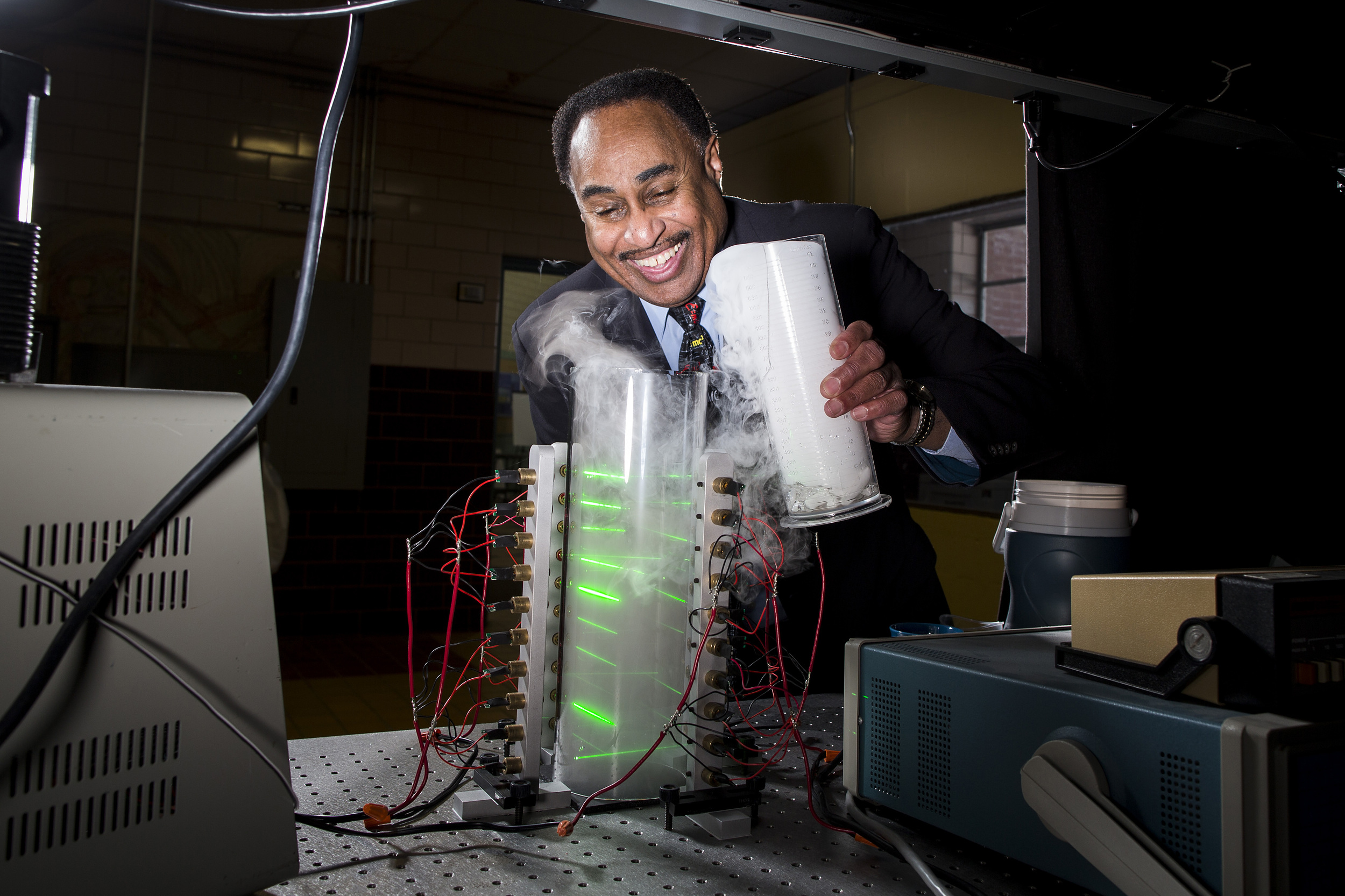   Theoretical physicist Ronald Mallett pours dry ice into a ring laser in this arranged photograph taken in a laboratory at the University of Connecticut in Storrs, Connecticut, U.S., on Monday, March 23, 2015. Mallett says he kept his work on time t