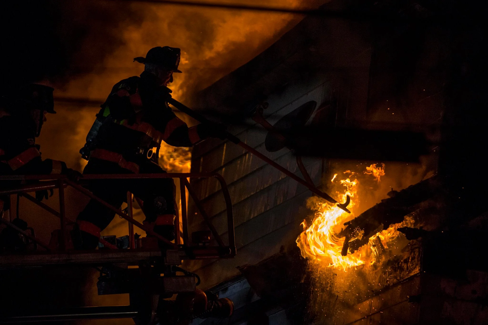 Firefighters battle a 3-alarm fire on Bruce Pl in Lynn, Mass. on December 4, 2015. Four occupants died in the blaze.
