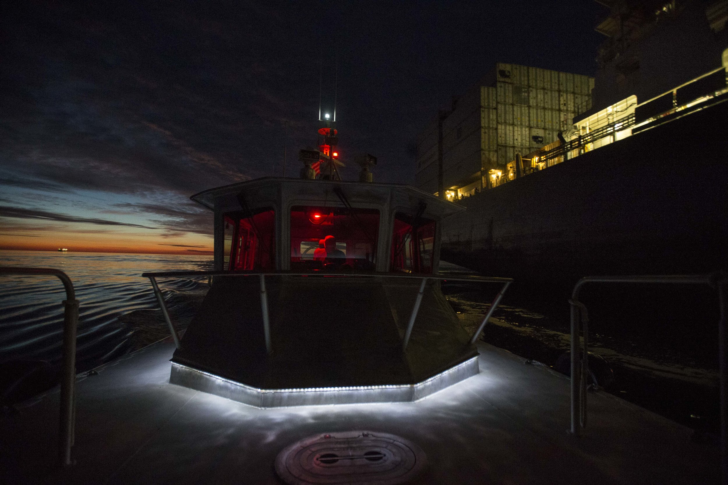  The pilot boat 'Chelsea' pulls away from the cargo ship MSC Lorena on Aug. 16 outside of Boston Harbor after putting Harbor Pilot Richard Stover aboard. 