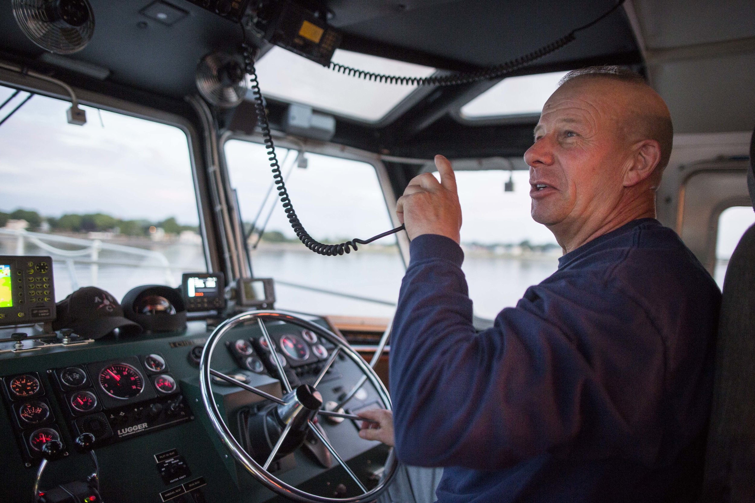  Pilot Boat Captain Joseph Maloney Jr. radios to the chemical tanker MTM St. Jean as he approaches with port pilot Scott MacNeil on Aug 16. 