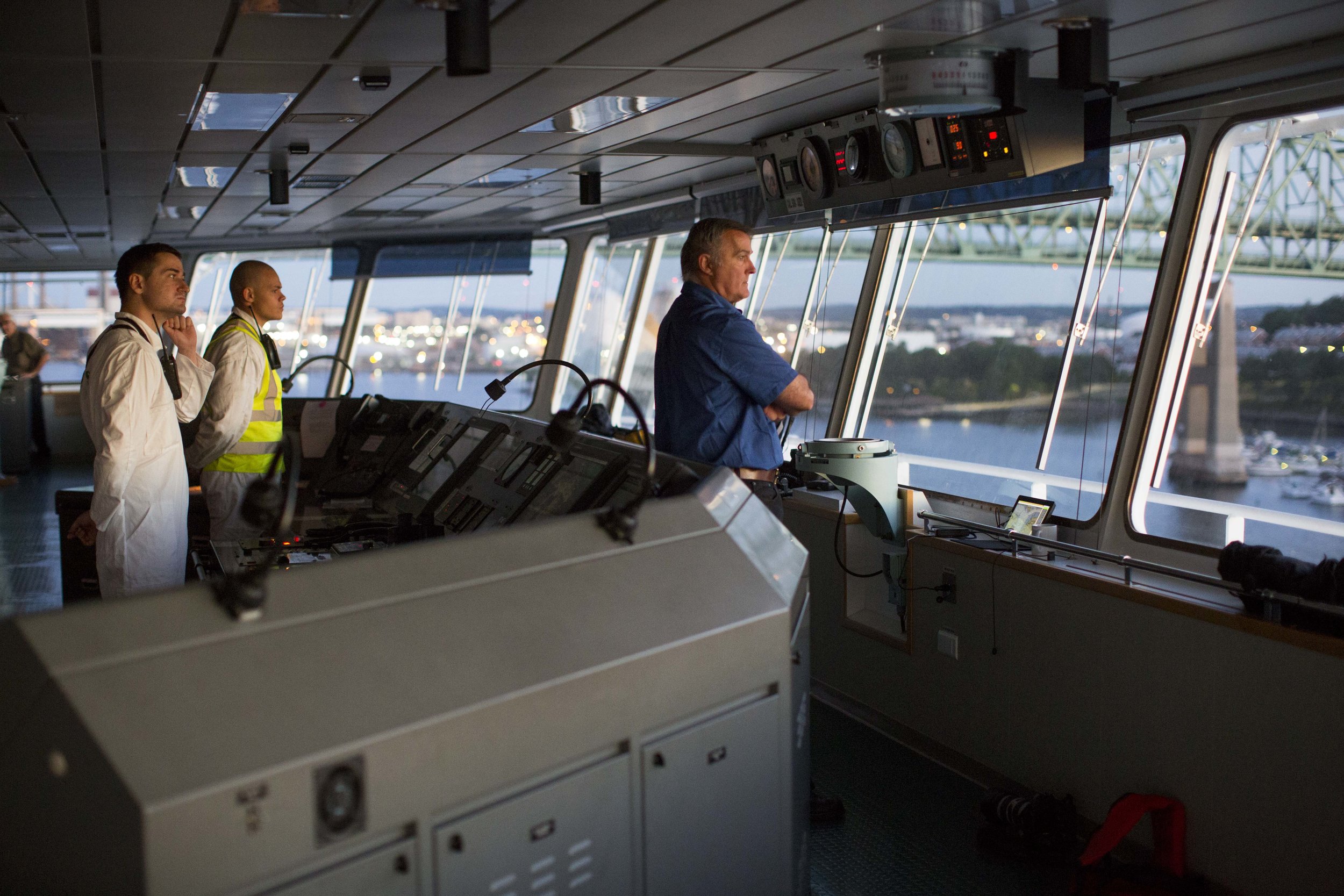  Boston Harbor Pilot Frank Morton watches from the wheelhouse of the car carrying ship Heroic Leader as it heads under the Tobin Bridge in Boston Harbor on Aug. 23. 