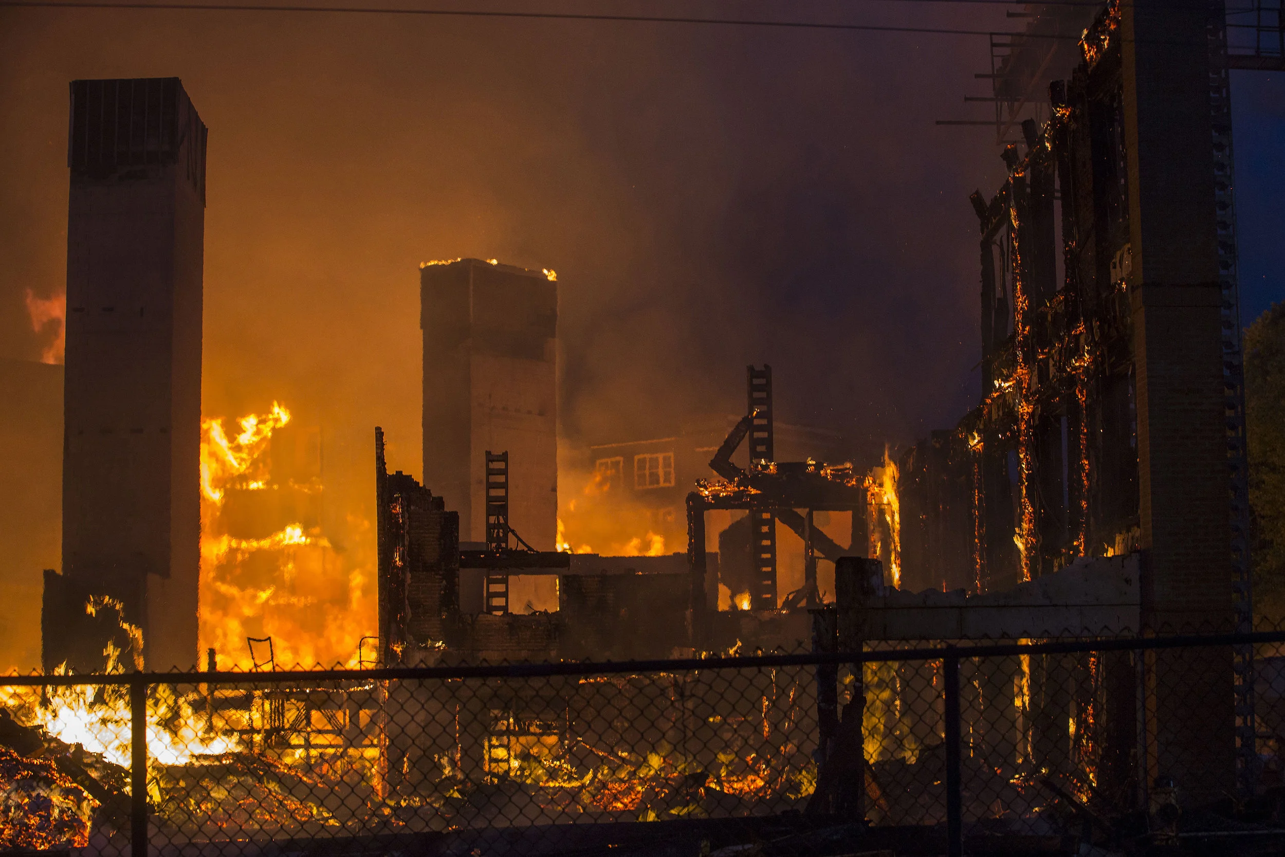  Burning rubble from part of an 8 alarm fire in Waltham on Sunday, July 23, 2017 that involved multiple structures. (Scott Eisen for The Boston Globe) 
