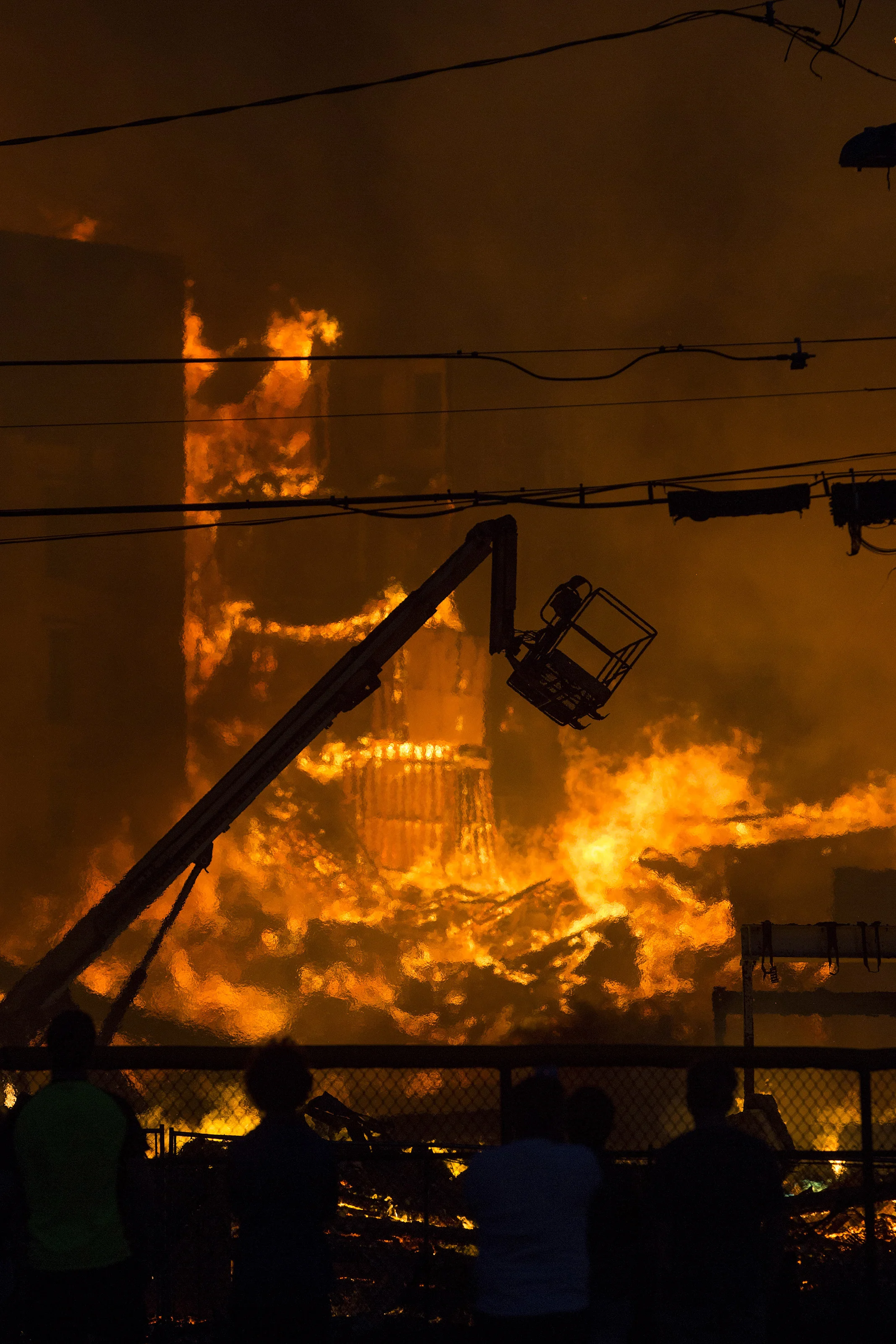  Burning rubble from part of an 8 alarm fire in Waltham on Sunday, July 23, 2017 that involved multiple structures. (Scott Eisen for The Boston Globe) 