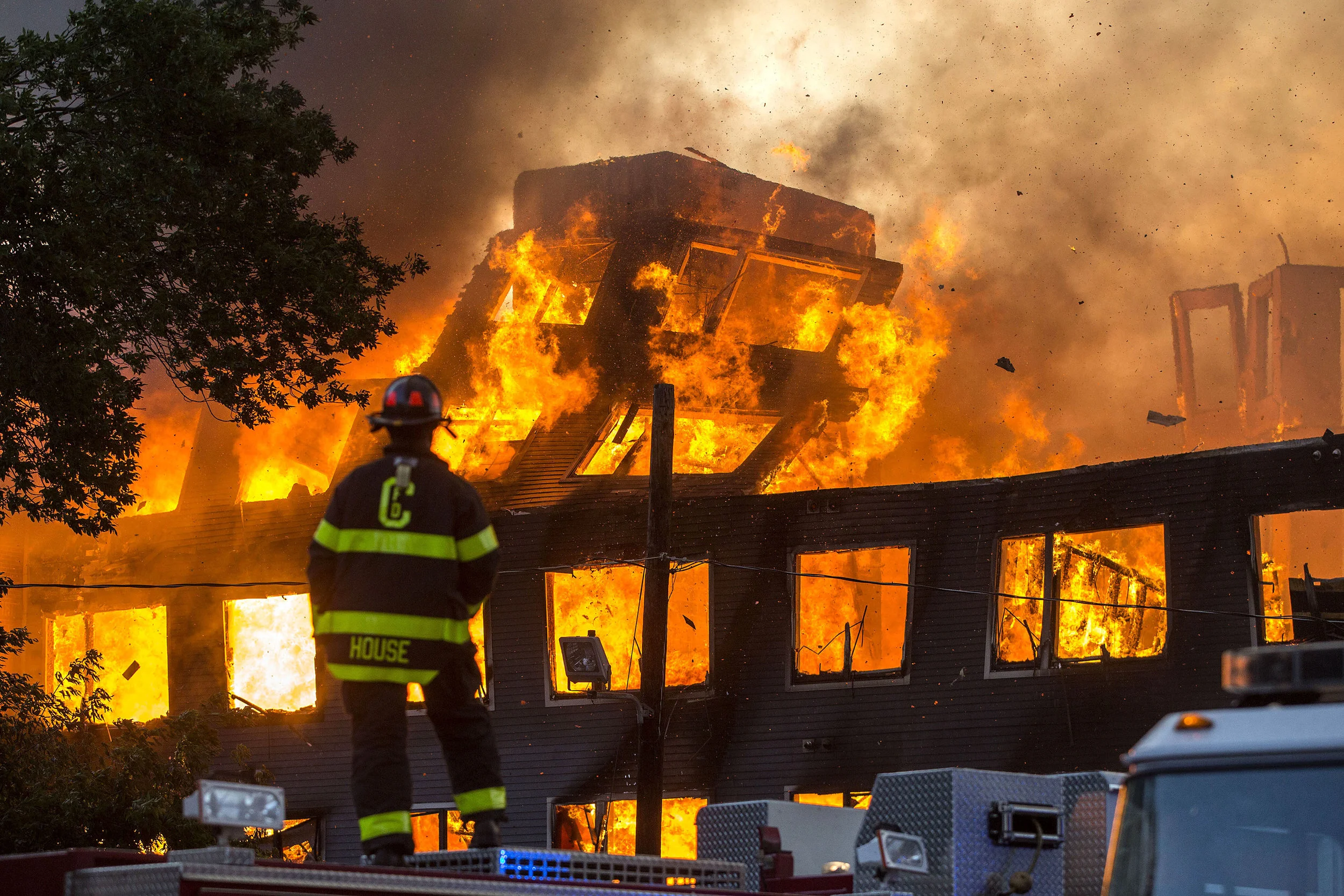  A building collapses at an 8-alarm fire where multiple buildings were fully involved in Waltham on Sunday, July 23, 2017 that involved multiple structures. (Scott Eisen for The Boston Globe) 